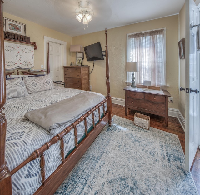 bedroom featuring hardwood / wood-style floors and ceiling fan