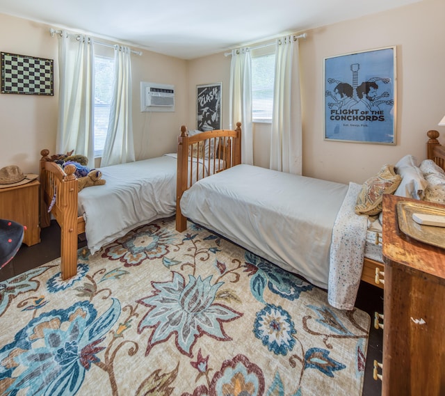 bedroom with a wall mounted air conditioner