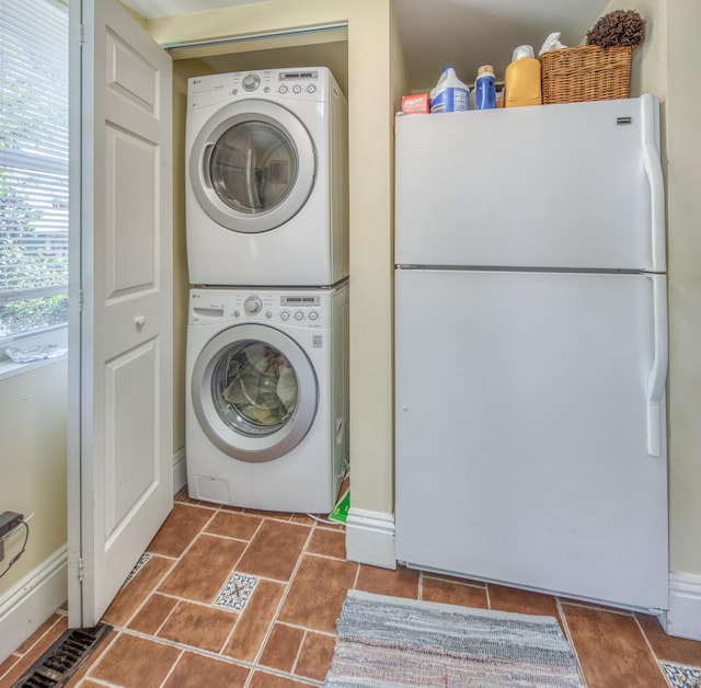 laundry area with stacked washing maching and dryer