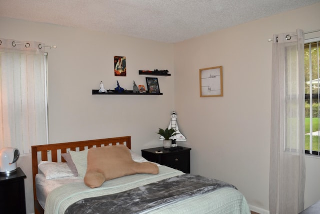 bedroom featuring a textured ceiling