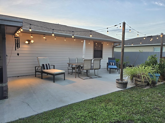 view of patio terrace at dusk