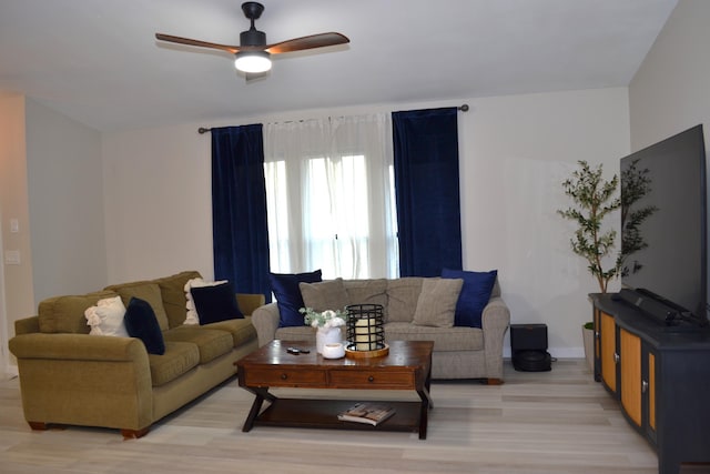 living room with ceiling fan and light wood-type flooring