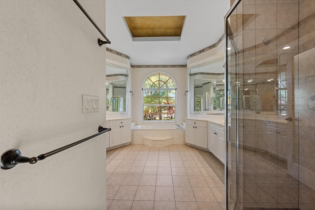 bathroom featuring tile patterned flooring, vanity, and separate shower and tub