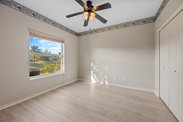 spare room featuring ceiling fan and light hardwood / wood-style floors