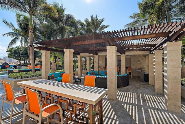 view of patio with an outdoor living space, an outdoor bar, and a pergola