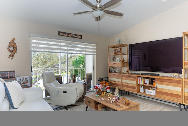 living room featuring light hardwood / wood-style floors and ceiling fan