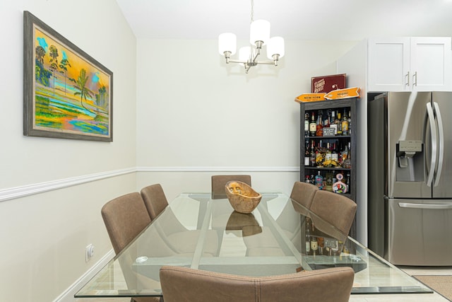 dining space featuring an inviting chandelier