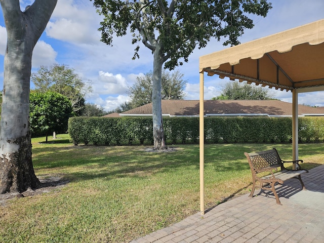 view of yard featuring a gazebo and a patio area