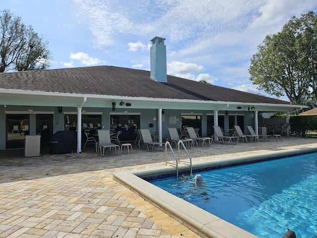 view of swimming pool featuring a patio