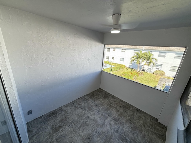 interior space featuring ceiling fan