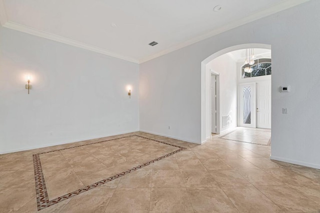 spare room featuring french doors and ornamental molding