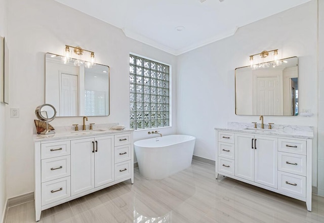 bathroom featuring a tub to relax in, hardwood / wood-style floors, vanity, and ornamental molding