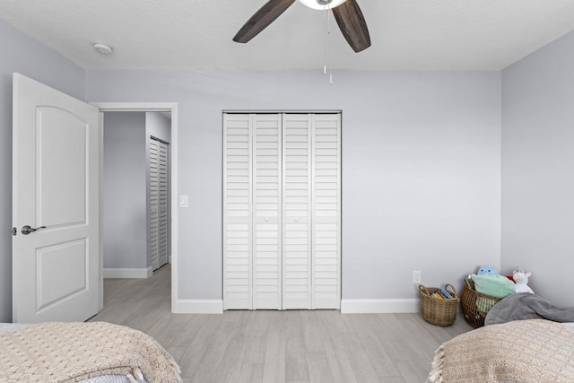 bedroom featuring ceiling fan and light hardwood / wood-style floors