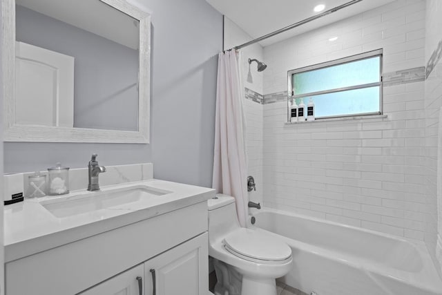 full bathroom with vanity, toilet, and shower / tub combo