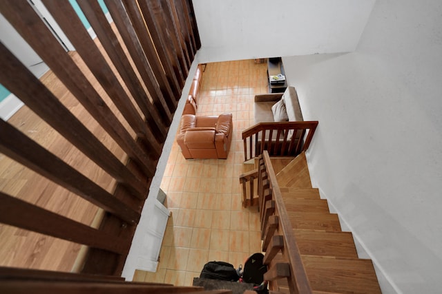 stairs featuring tile patterned floors