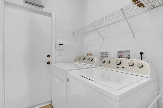 laundry area featuring washer and clothes dryer