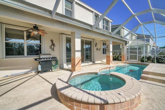 view of pool with ceiling fan, a patio area, an in ground hot tub, and grilling area