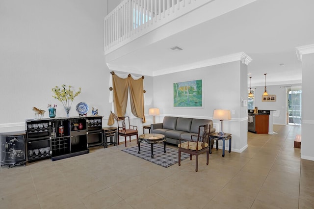 tiled living room with crown molding