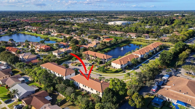 birds eye view of property featuring a water view