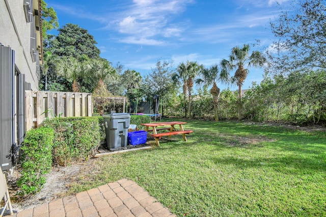 view of yard featuring a trampoline