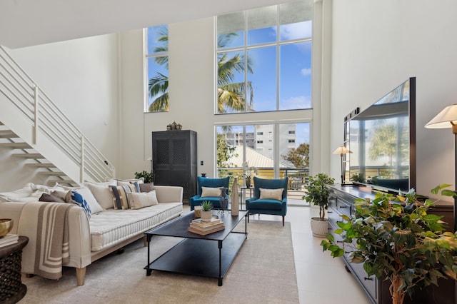 living room with a towering ceiling