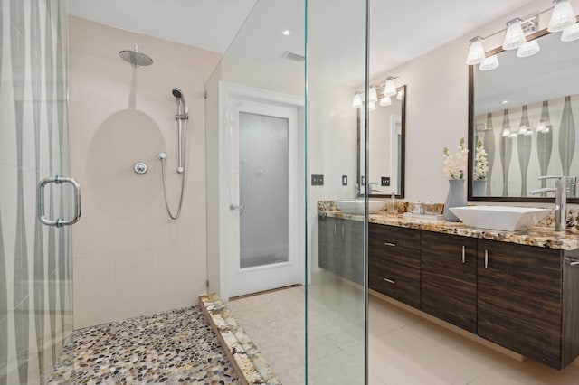 bathroom featuring tile patterned floors, vanity, and an enclosed shower