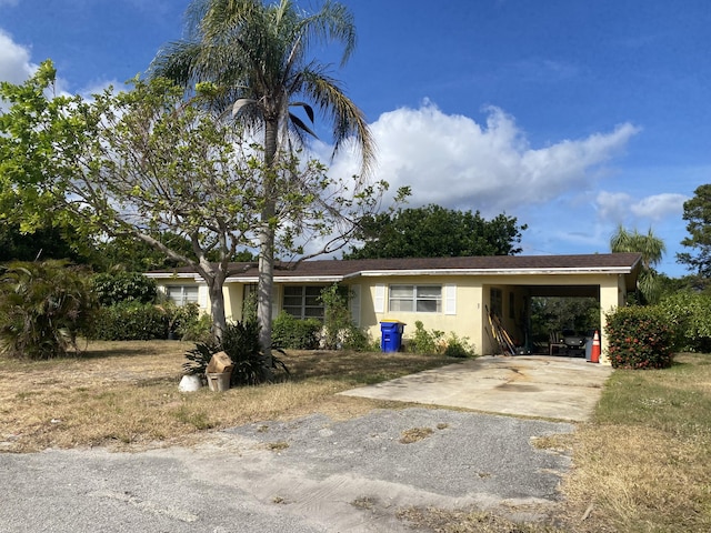 ranch-style house with a carport