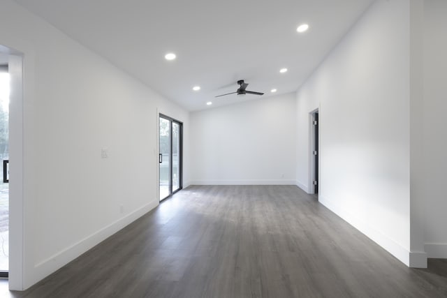 spare room featuring dark hardwood / wood-style floors and ceiling fan