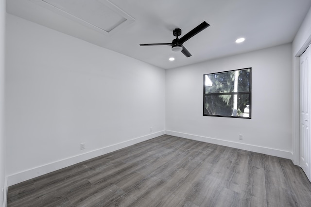 empty room featuring hardwood / wood-style floors and ceiling fan