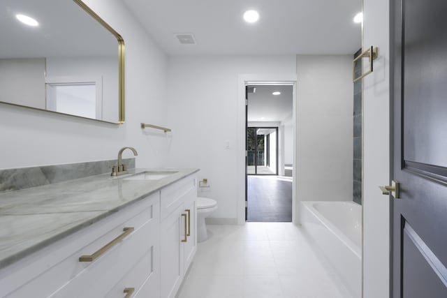 bathroom with tile patterned floors, vanity, and toilet