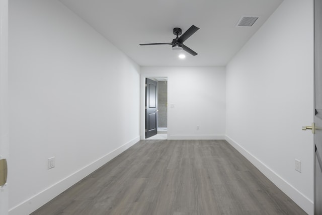 unfurnished room with hardwood / wood-style floors and ceiling fan