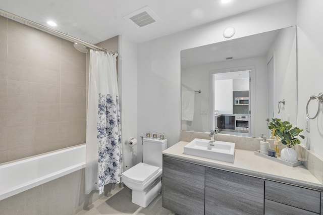 full bathroom featuring tile patterned floors, vanity, shower / bath combo, and toilet