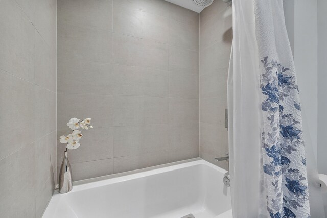 bathroom featuring shower / bath combination with curtain