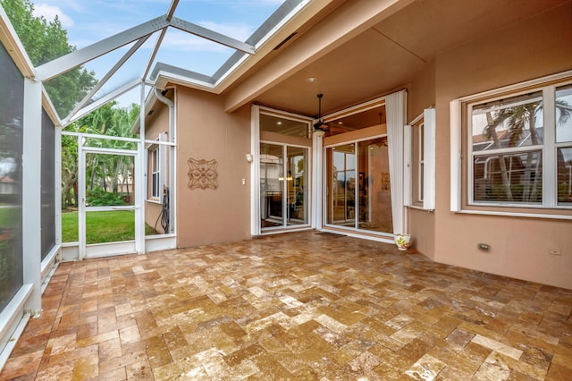 unfurnished sunroom featuring beamed ceiling