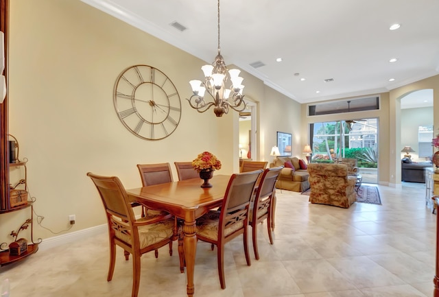 dining space featuring an inviting chandelier and ornamental molding