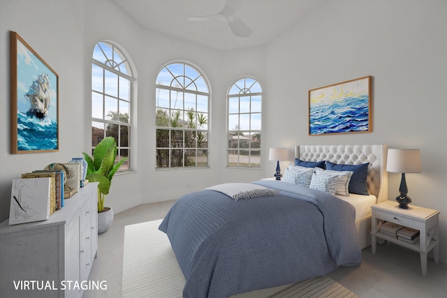 bedroom with light carpet and ceiling fan