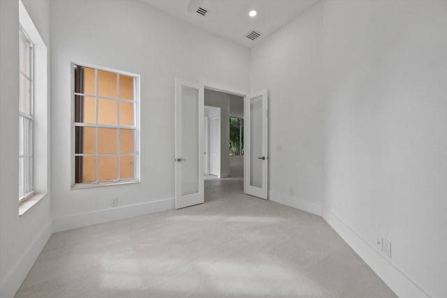 unfurnished room with french doors