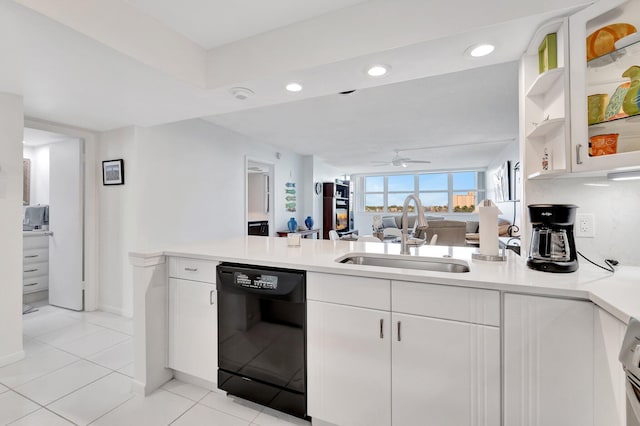 kitchen featuring sink, white cabinets, and black dishwasher