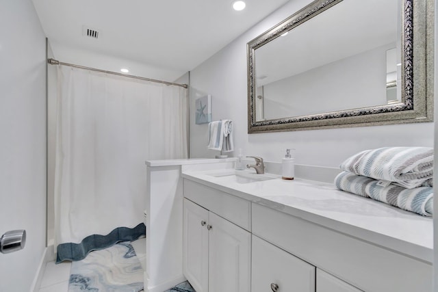 bathroom with tile patterned flooring, vanity, and a shower with shower curtain