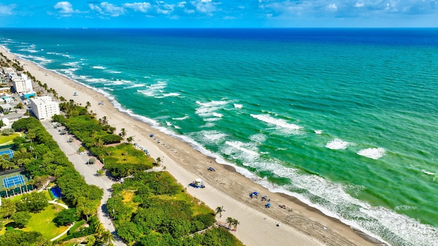 birds eye view of property featuring a view of the beach and a water view