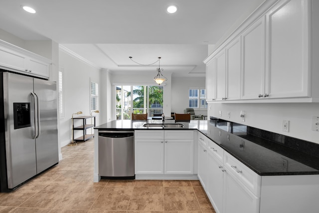 kitchen with white cabinets, sink, kitchen peninsula, and stainless steel appliances