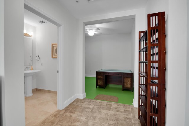 hall with light tile patterned flooring