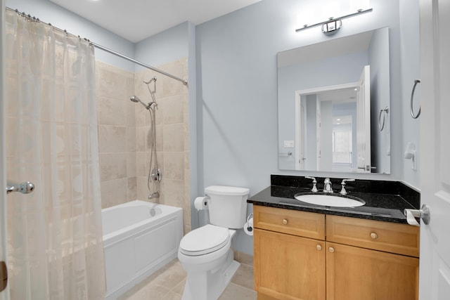 full bathroom with tile patterned flooring, vanity, toilet, and shower / bath combo with shower curtain