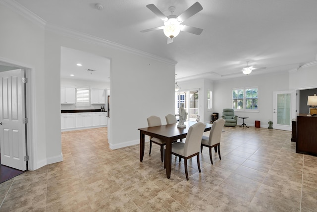 dining room with light tile patterned floors, ceiling fan, and crown molding