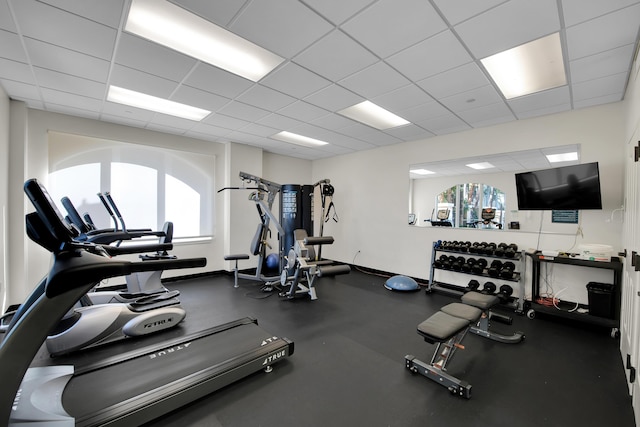 exercise room featuring a drop ceiling