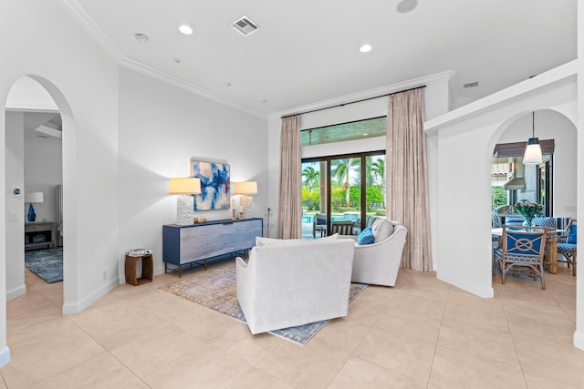 living room with light tile patterned floors and ornamental molding