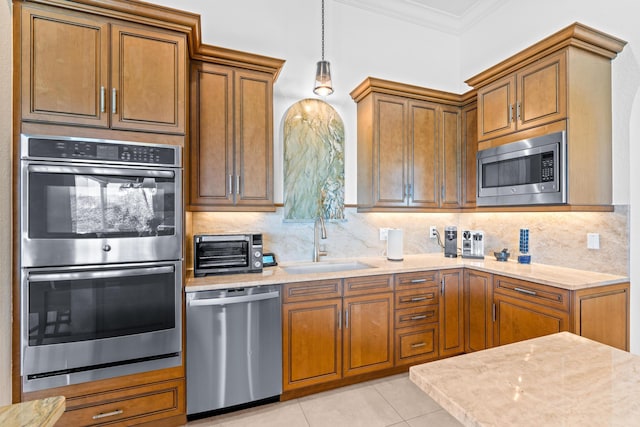 kitchen featuring sink, backsplash, appliances with stainless steel finishes, light tile patterned flooring, and ornamental molding