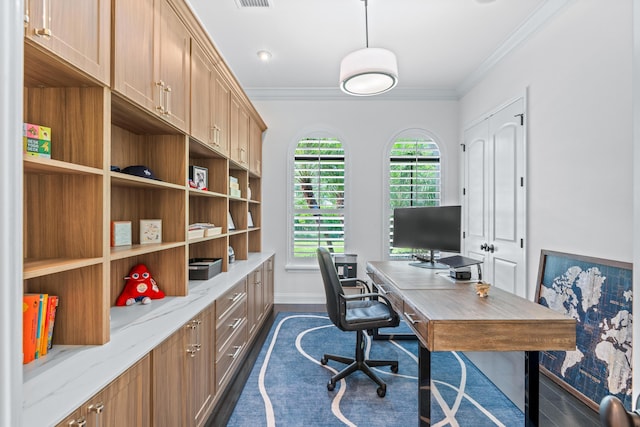 office with dark hardwood / wood-style flooring, a healthy amount of sunlight, and ornamental molding