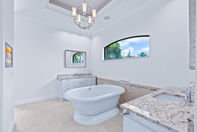 bathroom with a bath, vanity, tile patterned floors, and ornamental molding