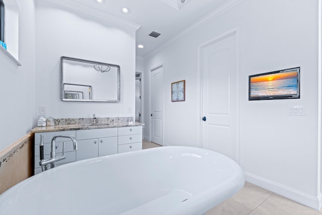 bathroom featuring crown molding, tile patterned flooring, vanity, and a bath